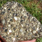 Pyrite (iron sulfide), when exposed to air and water, reacts to produce sulfuric acid. Pyrite was abundant in the historic Butte ore body.